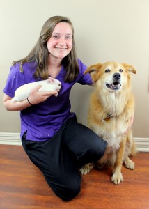 Chelsea posing with a dog and a bunny. Image from Beechmont Pet Hospital's old website.
