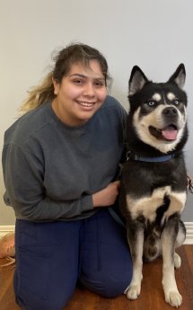 Elisa posing with a shepherd-husky mix. Image from Beechmont Pet Hospital's old website.