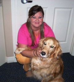 Heather Rout posing with a golden retriever. Image from Beechmont Pet Hospital's old website.