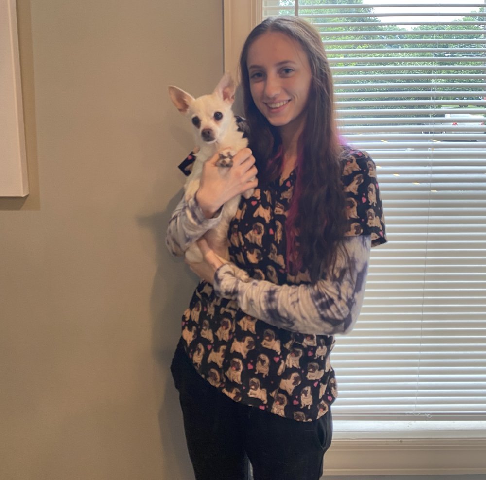 Jennifer holding a chihuahua. Image from Beechmont Pet Hospital's old website.