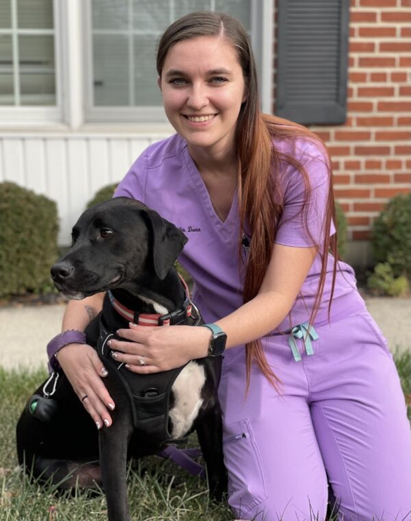 Dr. Jennifer Wisman posing with a black lab. Image from Beechmont Pet Hospital's old website.