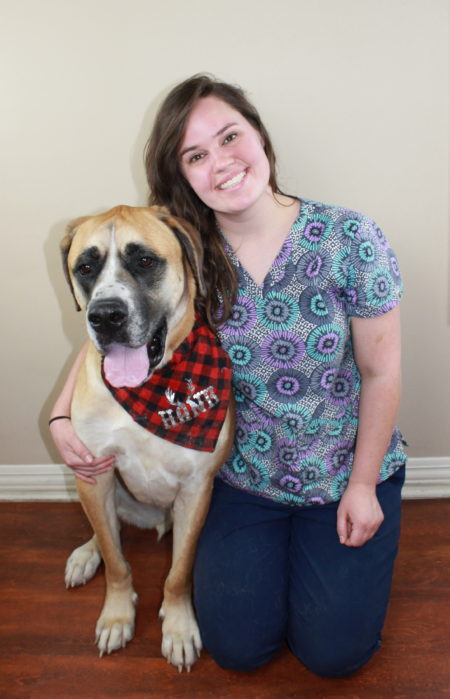 Margie posing with a large dog. Image from Beechmont Pet Hospital's old website.