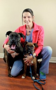 Sara C. posing with two dogs. Image from Beechmont Pet Hospital's old website.